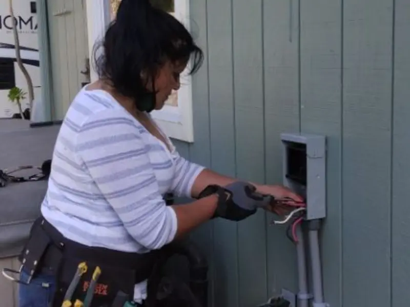 Licensed electrician wiring an exterior subpanel in Hereford