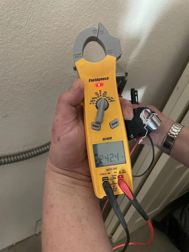 Voltage testing with clamp meter during Electrical Installation Services in Hereford